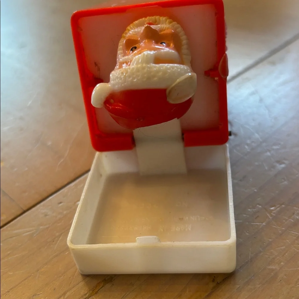 Vintage Pop-Up Squeaky Toy Santa in Chimney